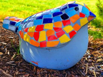 Close-up of multi colored umbrella on land