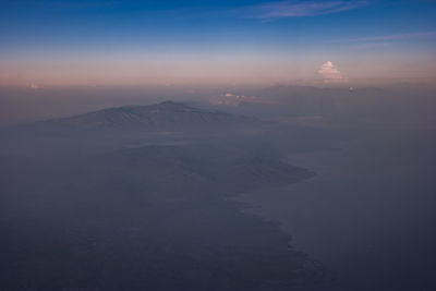 Scenic view of mountains against sky during sunset