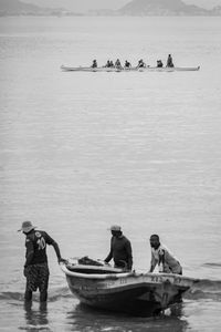 People on boat in sea