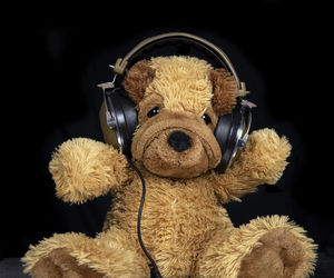 Close-up of stuffed toy against black background