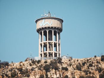 Low angle view of building against clear blue sky