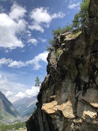 Low angle view of rock formations against sky