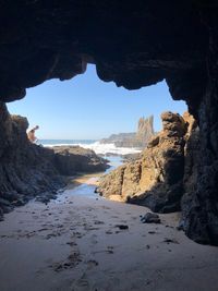 Scenic view of beach against clear sky