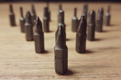 Close-up of work tools arranged on wooden table