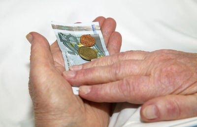 Close-up of hand holding text