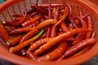 High angle view of red chili peppers in basket