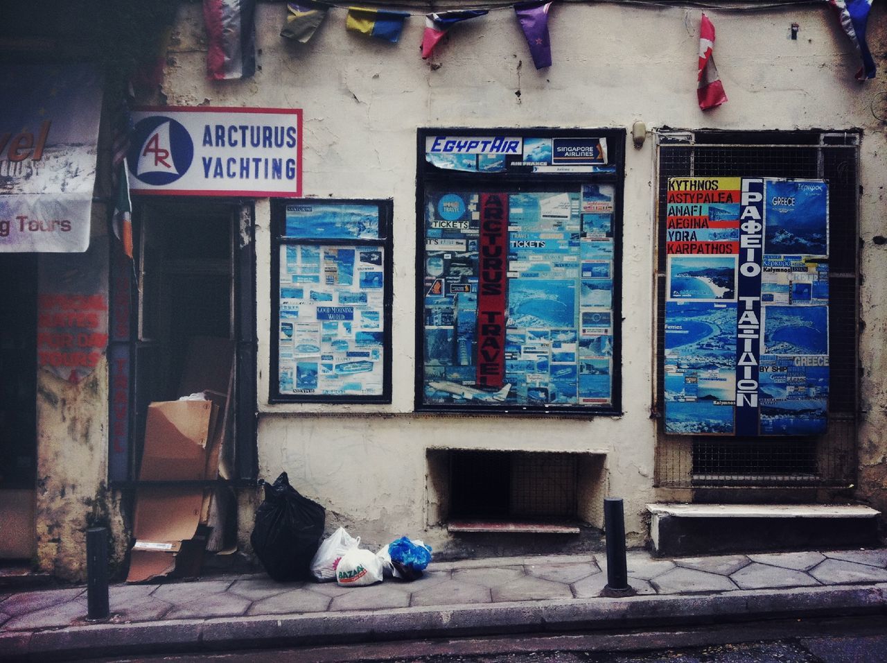 architecture, built structure, building exterior, blue, window, house, abandoned, text, door, day, graffiti, obsolete, no people, store, communication, outdoors, western script, damaged, wall - building feature, building