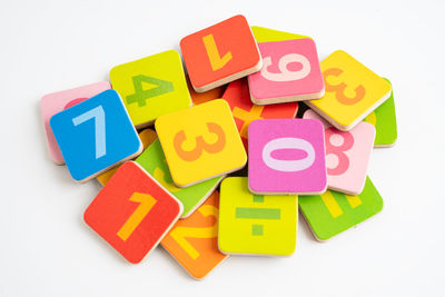 Close-up of multi colored toy blocks against white background