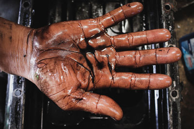 Hands stained with engine oil