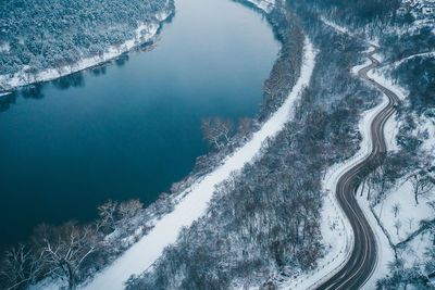 High angle view of road by trees during winter