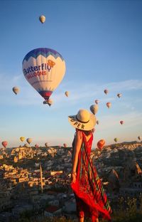 View of hot air balloons in city