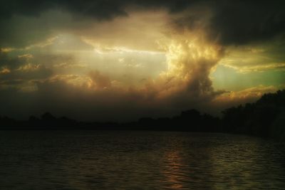 Scenic view of sea against cloudy sky