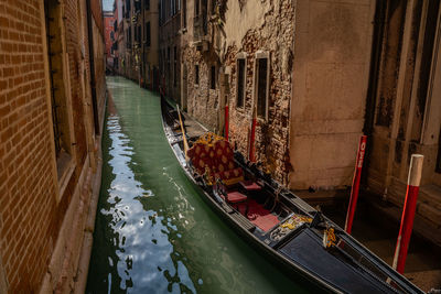 High angle view of canal amidst buildings in city