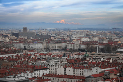 Aerial view of town against sky during sunset