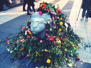 Low section of woman with flowers