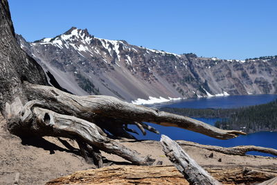 Scenic view of mountains against clear blue sky