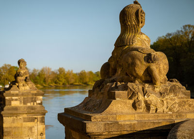 Statue of buddha against sky