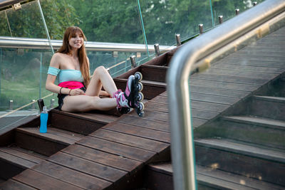 Low section of woman sitting on staircase