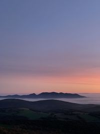 Scenic view of silhouette landscape against sky during sunset