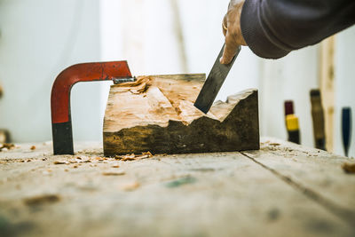 Close-up of carpenter working on wood