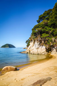 Scenic view of sea against clear blue sky