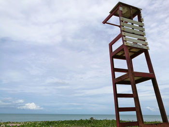 Low angle view of tower against cloudy sky