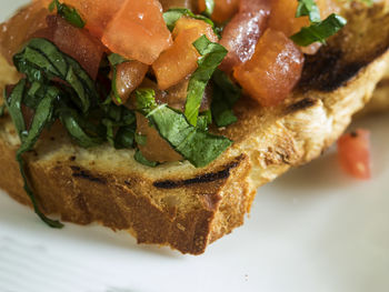 Close-up of bread and salmon in plate