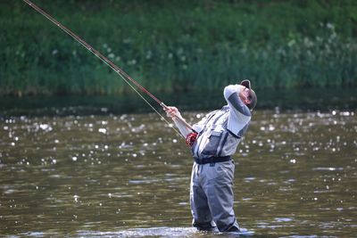 Man fishing in water