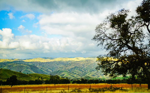 Scenic view of landscape against dramatic sky