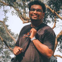 Low angle view of man standing against trees