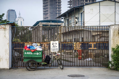 Bicycles on street against buildings in city