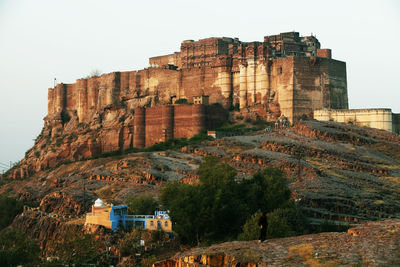 Low angle view of mehrangarh fort against clear sky