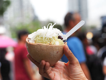 Close-up of hand holding ice cream