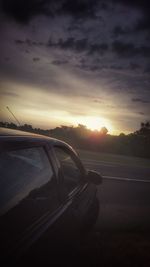 Close-up of road against sky during sunset