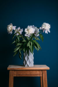 Close-up of white flower vase on table