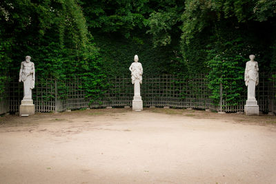 Statue against trees in park