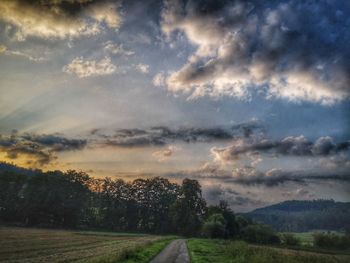 Scenic view of land against sky during sunset