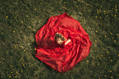 High angle view of person lying on field