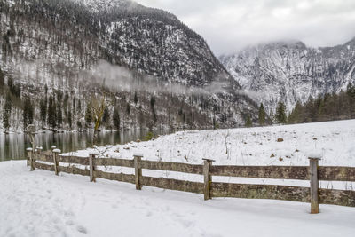 Scenic view of snowcapped field during winter