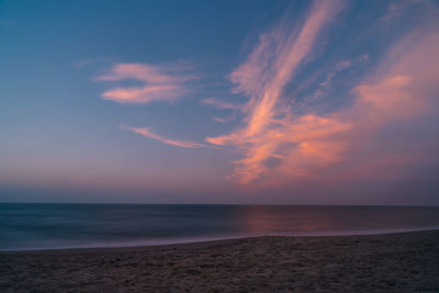 Scenic view of sea against sky at sunset