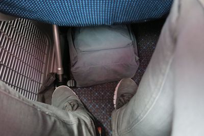 Low section of man sitting on floor