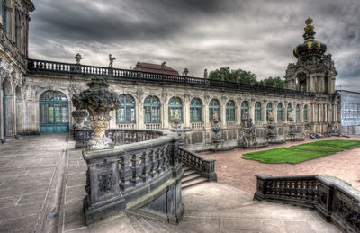 Statue of historic building against cloudy sky