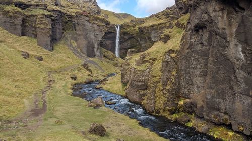 Scenic view of waterfall and rock formations