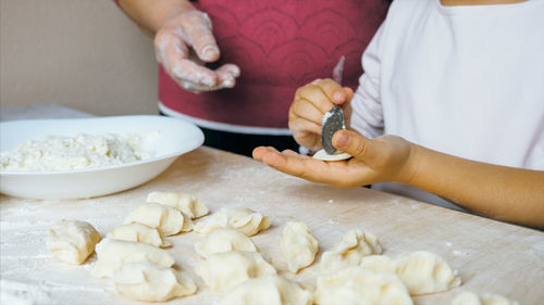 Midsection of woman preparing food