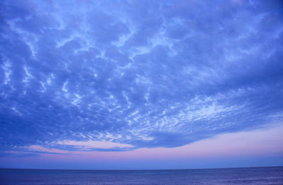 Scenic view of sea against blue sky