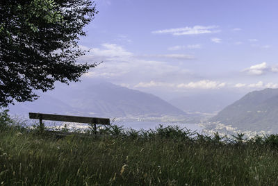 Scenic view of mountains against cloudy sky