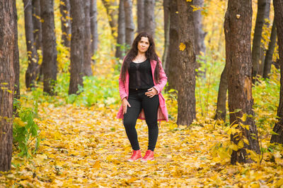 Full length of woman in forest during autumn