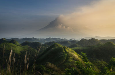 Scenic view of mountains against sky during sunset