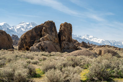 Rock formations on landscape against sky