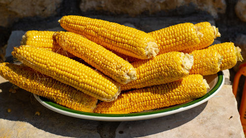 Close-up of yellow and vegetables on table